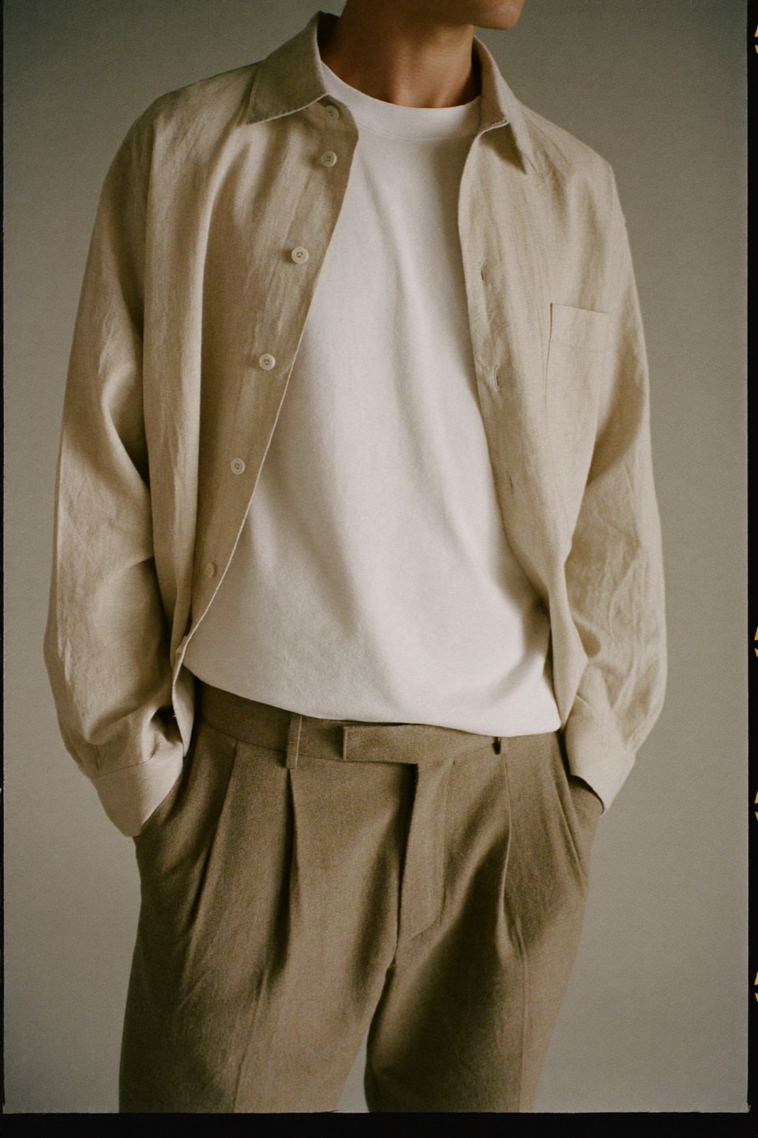 Oatmeal linen overshirt over a white tee, editorial look from the boards